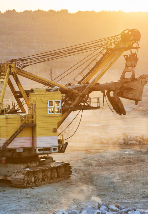 Heavy mining machinery operating in a quarry